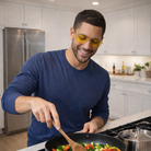 all groups aviator relax swannies blue light eyeglasses worn by a man cooking. 