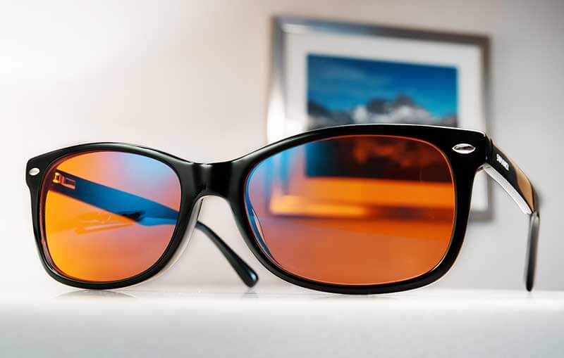 Black Classic Night Swannies Blue Light-blocking Glasses On Desk With Picture