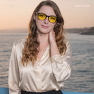 Woman wearing Relax Blue-Banned Swannies with a scenic background