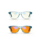 Two pairs of  Kid's Swannies, one with blue frames and Focus lenses, the other with blue frames and orange-tinted Sleep lenses, on a white background.